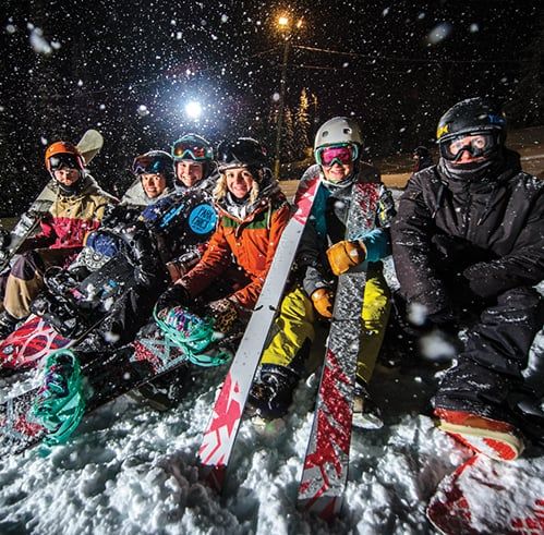 Ski group in night snow